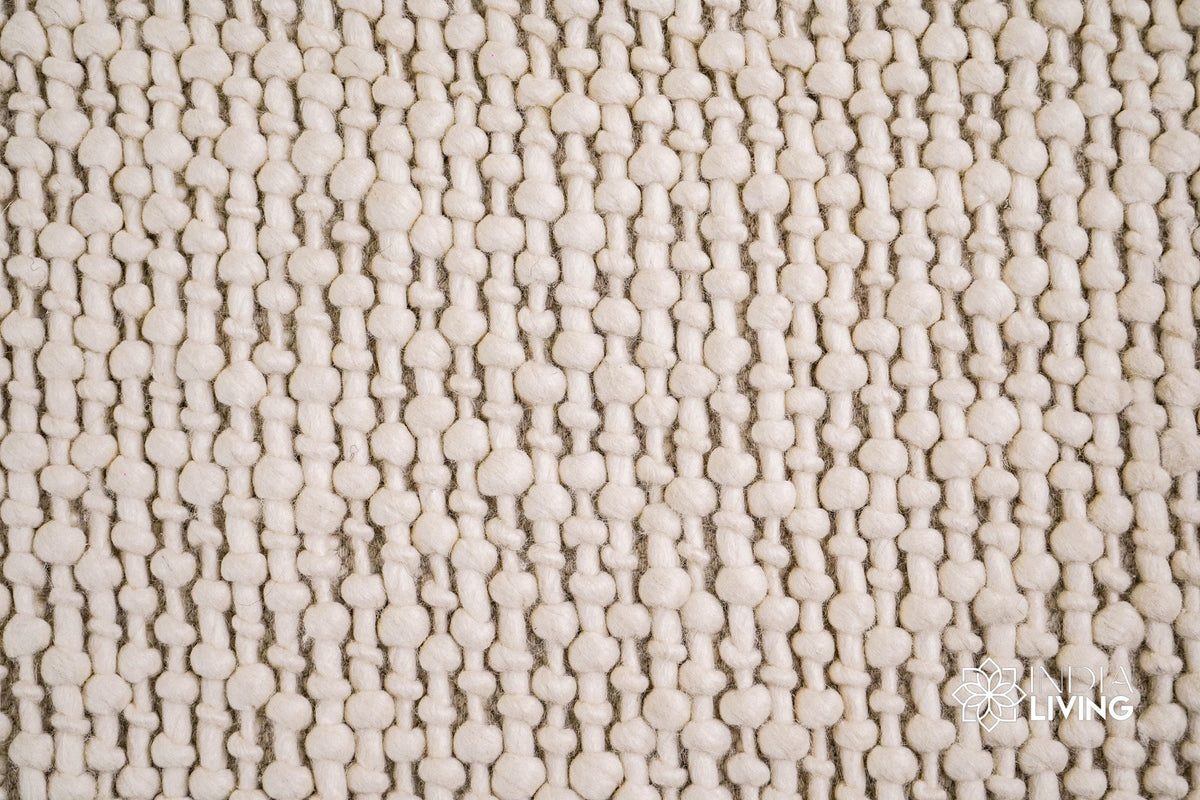 Ivory wool rug corner detail with fringe