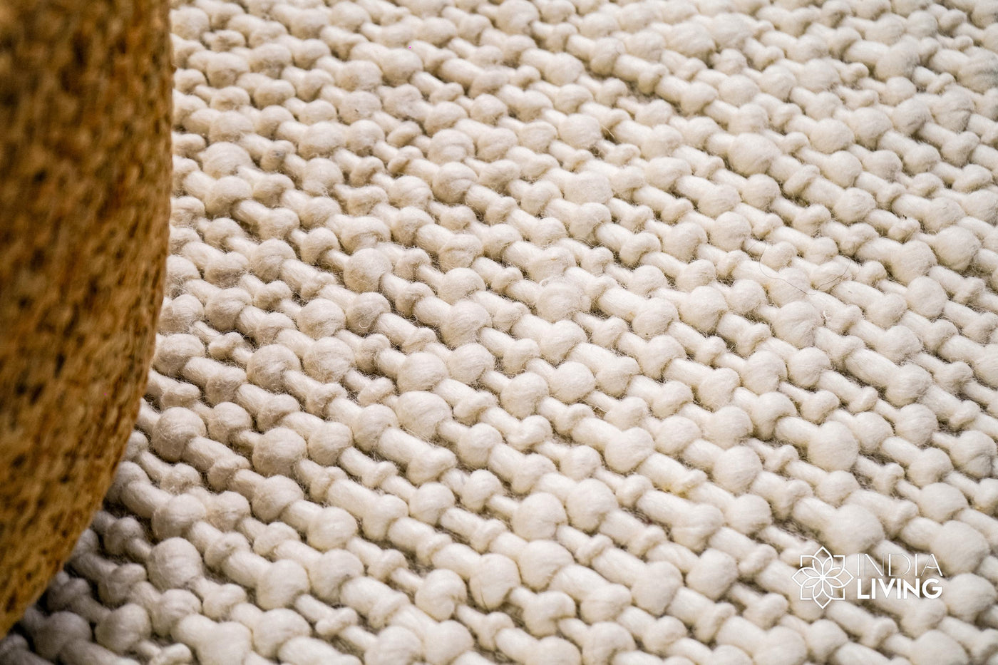 Natural ivory basket weave wool rug, flat lay view