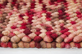 Beige red wool rug full view from above