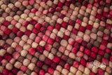 Beige red wool rug placed under furniture in a living space