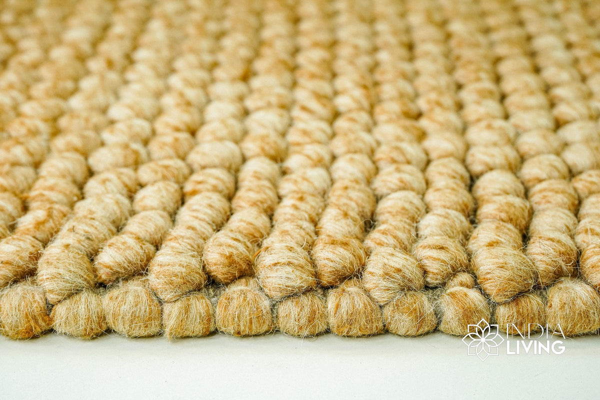 Tan beige wool rug texture close-up