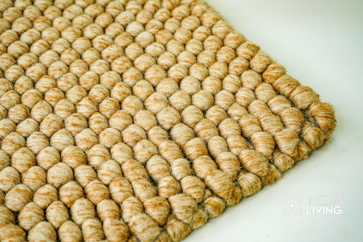 Tan beige wool rug in a bedroom decor setting