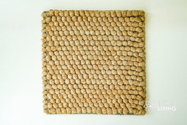 Tan beige wool rug styled in a living room setting