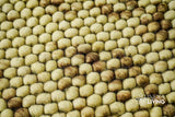 Coffee beige wool rug placed under furniture in a living space