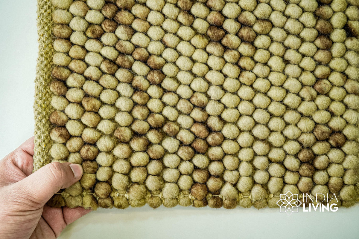 Coffee beige wool rug texture close-up