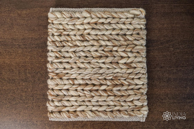 Beige brown braided wool rug flat lay showing chunky texture