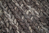 Charcoal grey wool rug placed under furniture