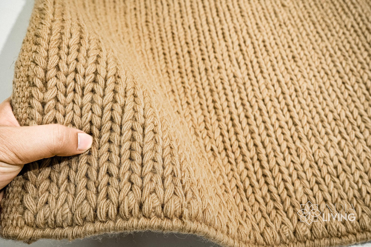 Sumac braided wool rug styled in a living room