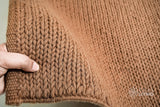 Sumac braided wool rug texture close-up