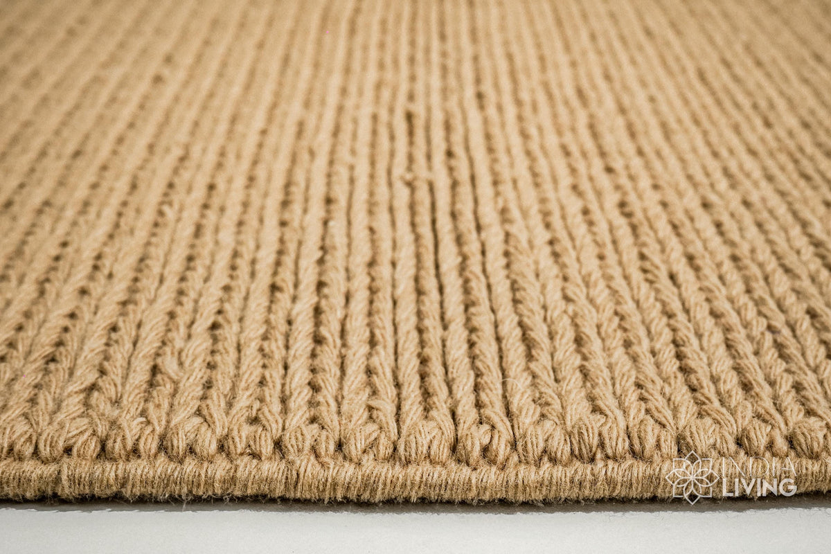 Tan beige wool rug placed under furniture