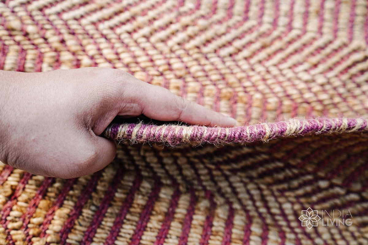 Pink jute round rug in a dining room setting