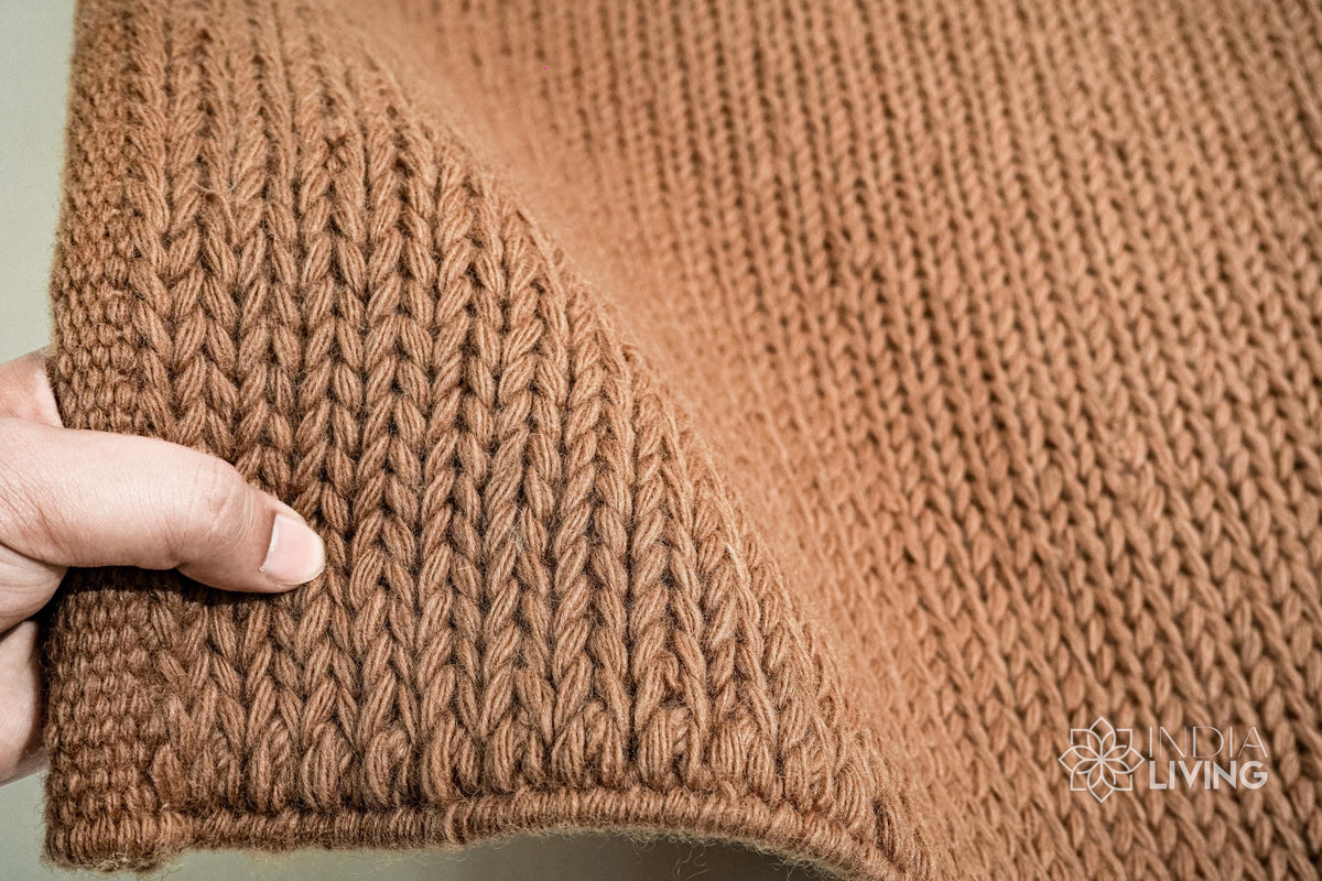 Tan brown braided wool rug flat lay showing texture