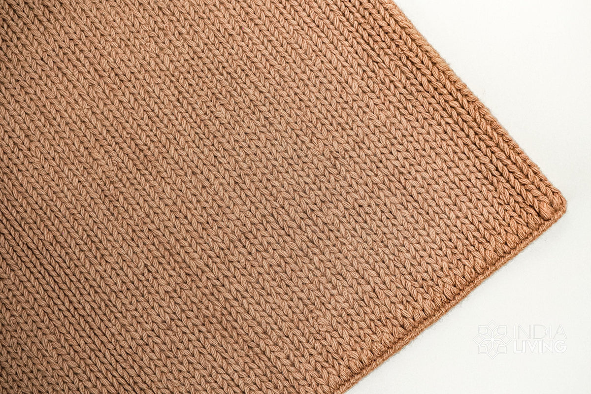 Tan brown wool rug corner and edge detail