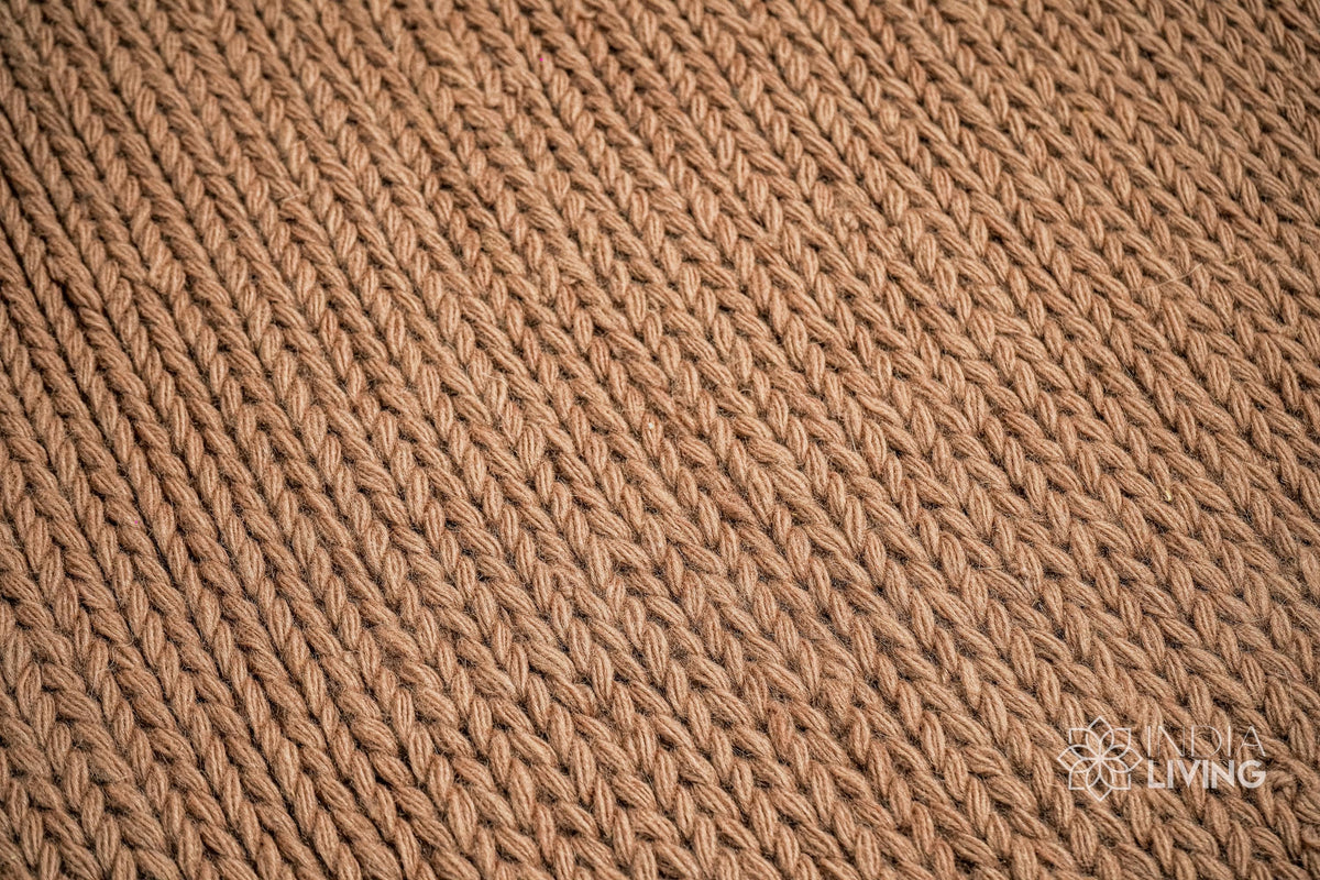 Tan brown wool rug texture close-up