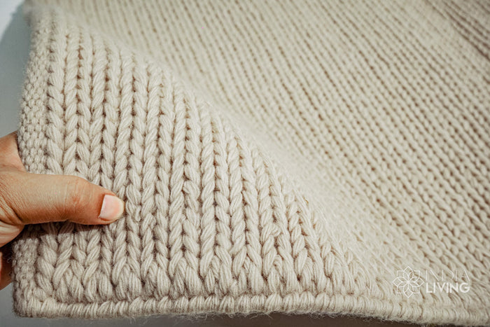 Natural ivory braided wool rug flat lay showing texture