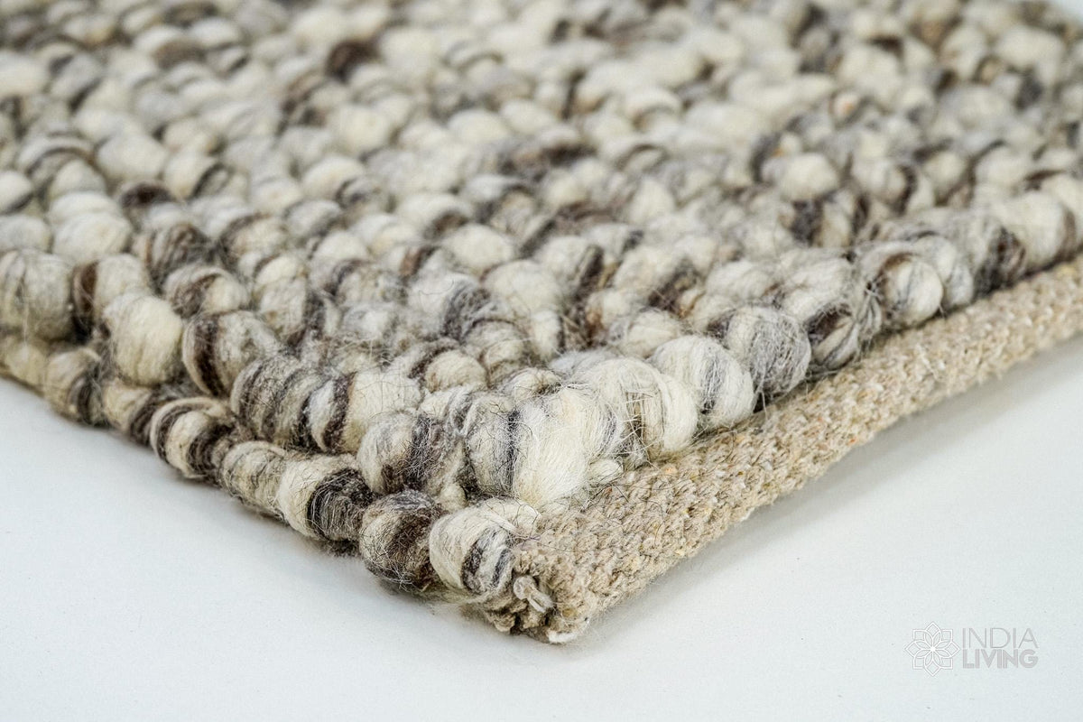 Ivory brown wool rug placed in a pet-friendly living space