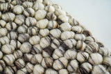 Ivory brown wool rug in a cozy bedroom setting