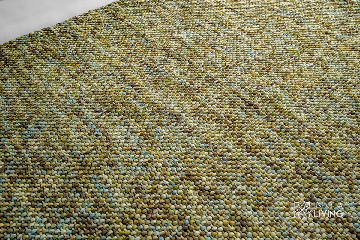 Multi green wool rug in a modern styled room