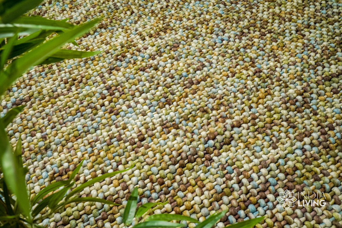 Green wool rug pile texture close-up in natural light