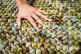 Green wool rug corner and edge detail