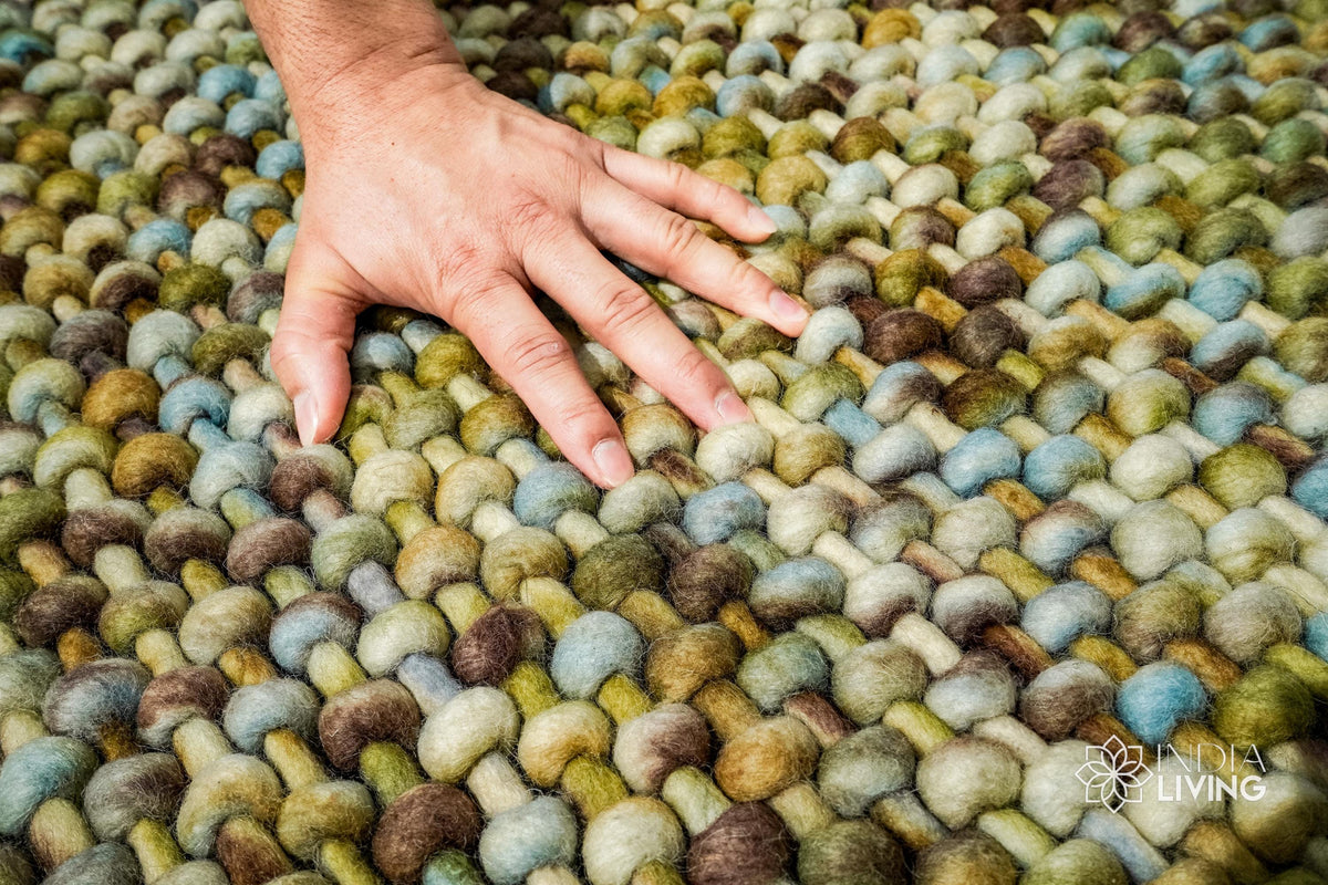 Green wool rug corner and edge detail