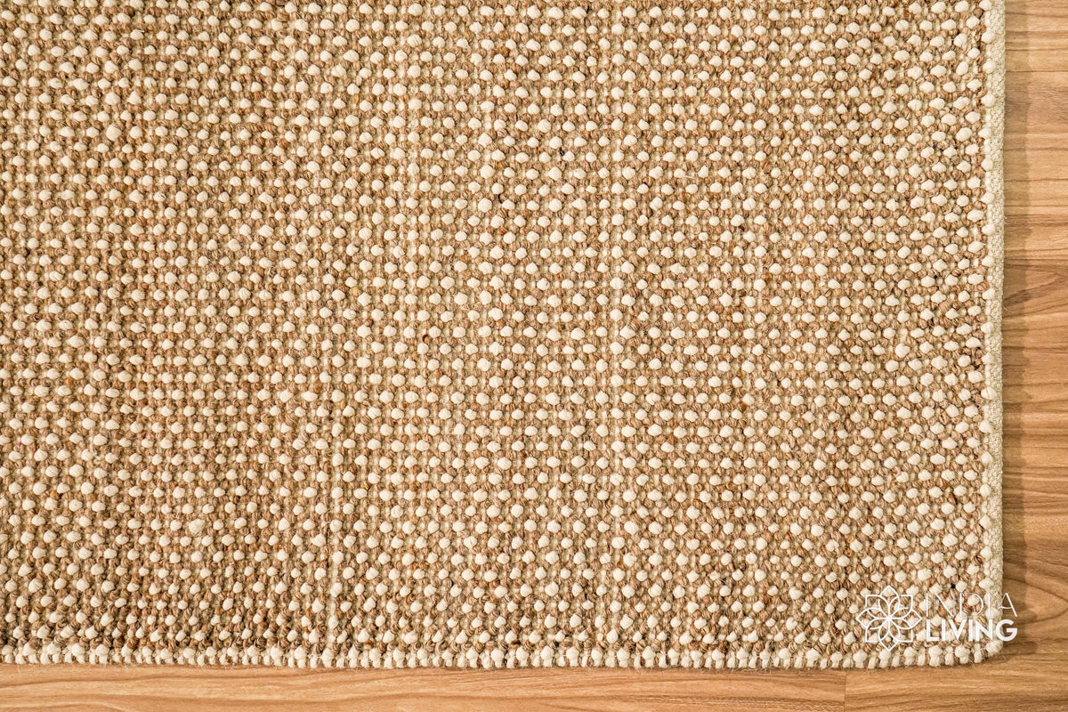 Beige wool rug shown at an alternate angle