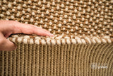 Beige wool rug edge detail