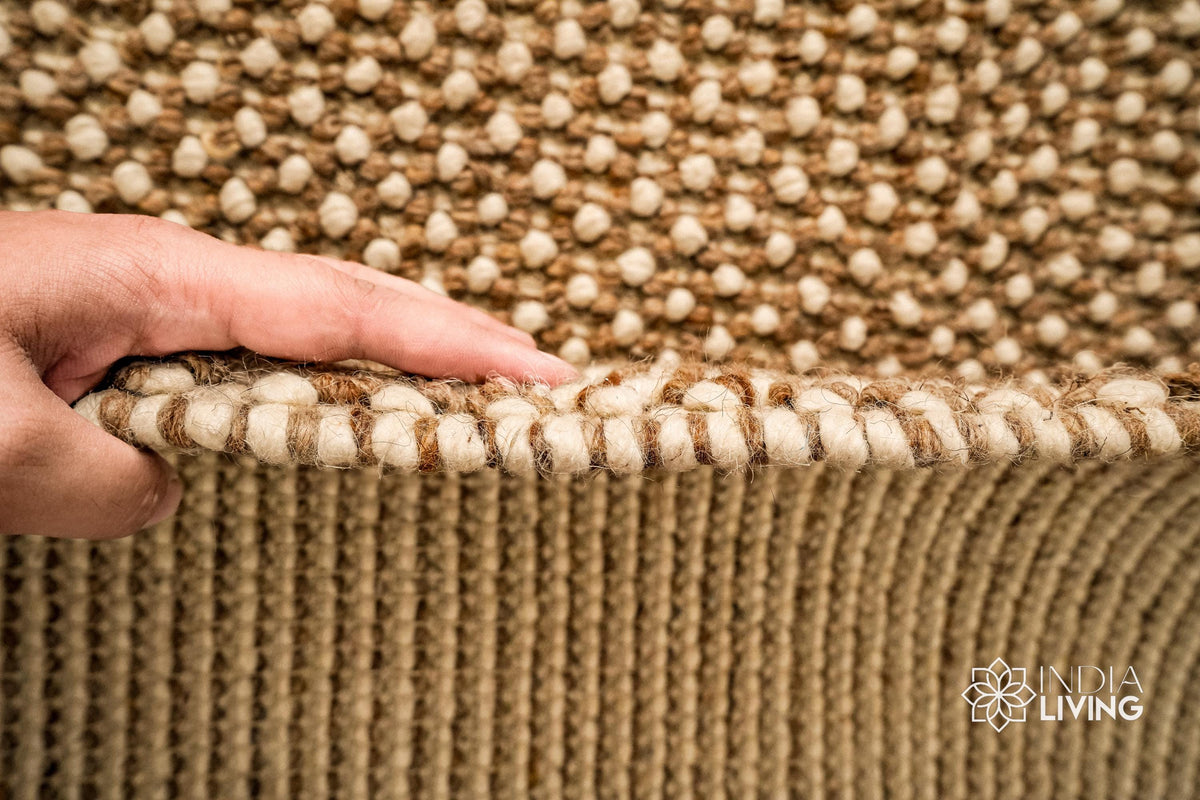 Beige wool rug edge detail