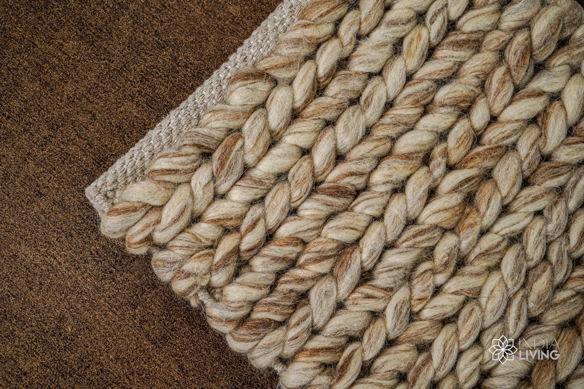Close-up of beige brown wool rug braided texture