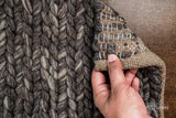 Charcoal grey wool rug corner and edge detail