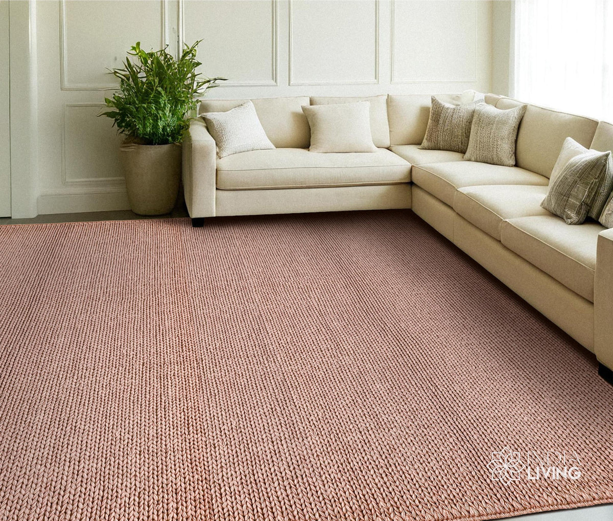 Close-up of light pink wool rug braided knit texture