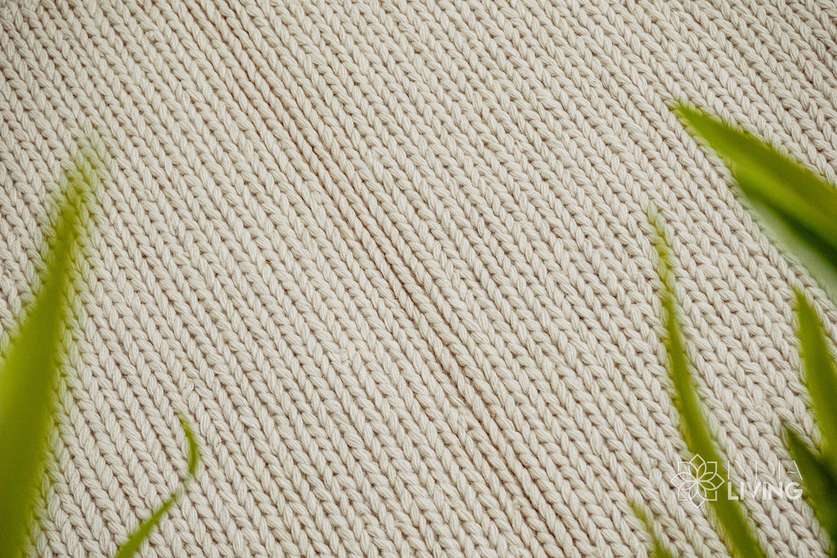 Ivory wool rug in a Scandinavian bedroom setting
