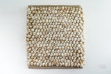 Close-up of chunky wool loop pile texture in natural beige