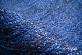 Blue oval jute rug in natural light