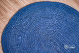 Blue jute rug styled in living room