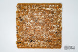 Close-up of raw wool texture in rust brown