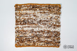 Close-up of organic wool texture in ivory brown