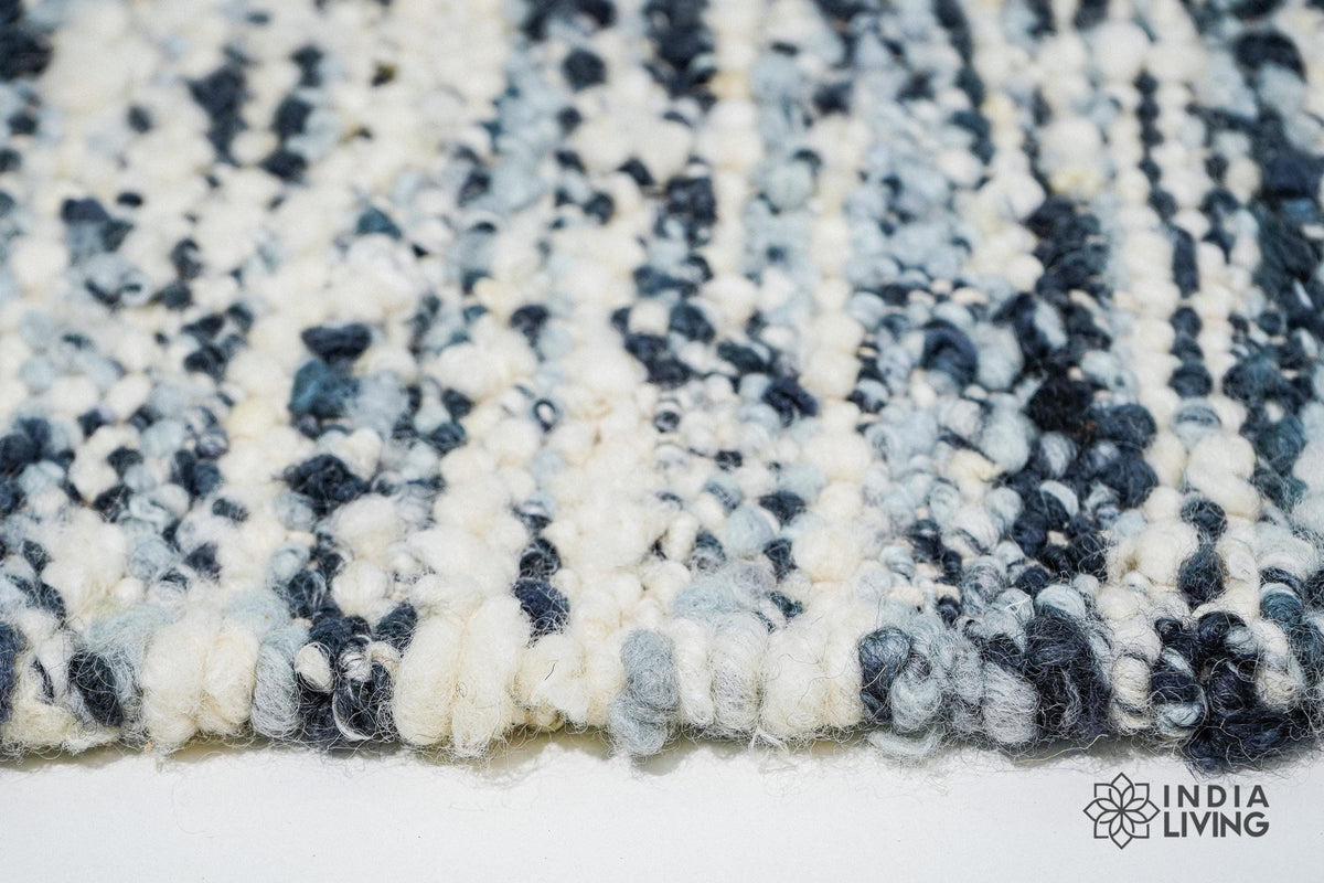 Ivory blue wool rug in a minimalist bedroom
