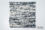 Close-up of organic wool texture in ivory blue