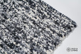 Ivory black wool rug in a bohemian bedroom