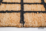 Checkered jute runner rug in a boho-styled room