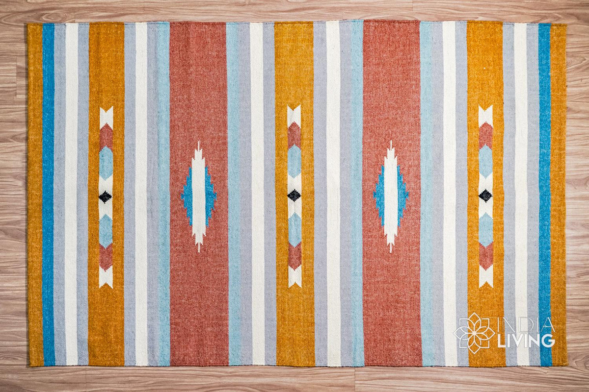 Wide shot of striped kilim rug on floor