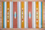 Wide shot of striped kilim rug on floor