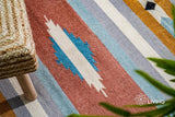 Striped kilim rug styled in a living room
