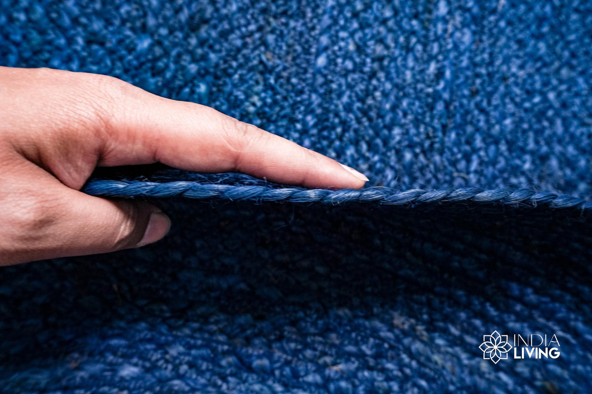 Oval rug corner detail showing braided edge