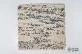 Close-up of organic wool texture in ivory grey