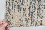Texture close-up of handwoven ivory grey wool