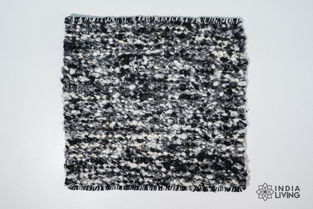 Close-up of organic wool texture in ivory black