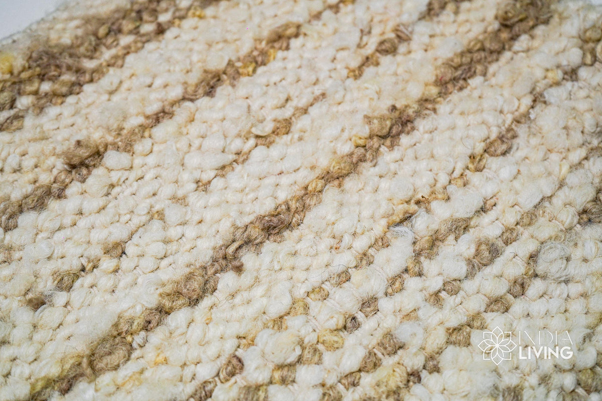 Texture close-up of handwoven ivory beige wool