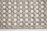 Beige cream wool rug in a boho-styled entryway